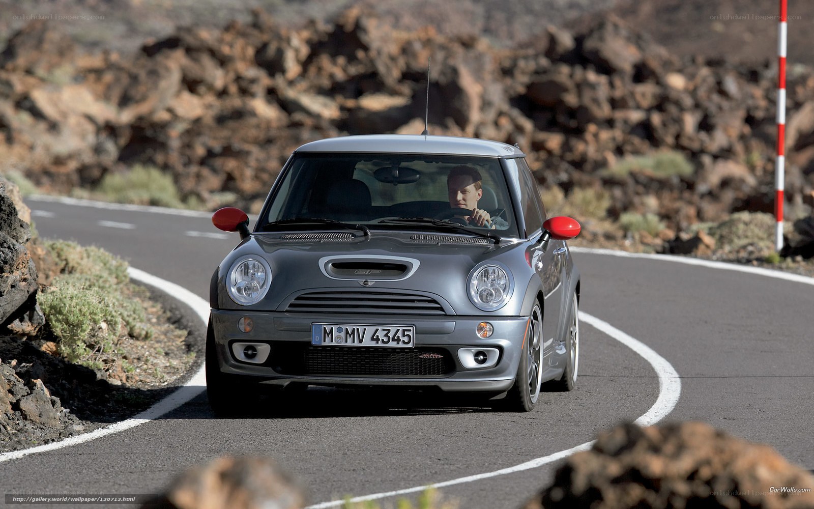 silver mini cooper on winding road