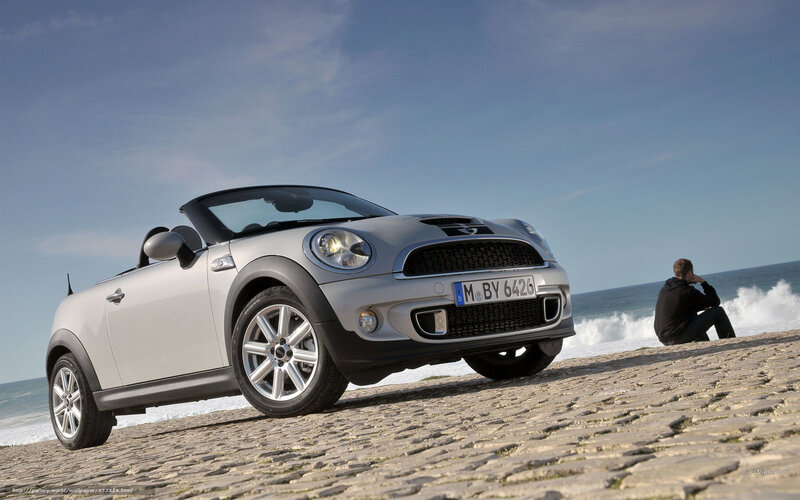 Silver MINI Cooper parked on beach