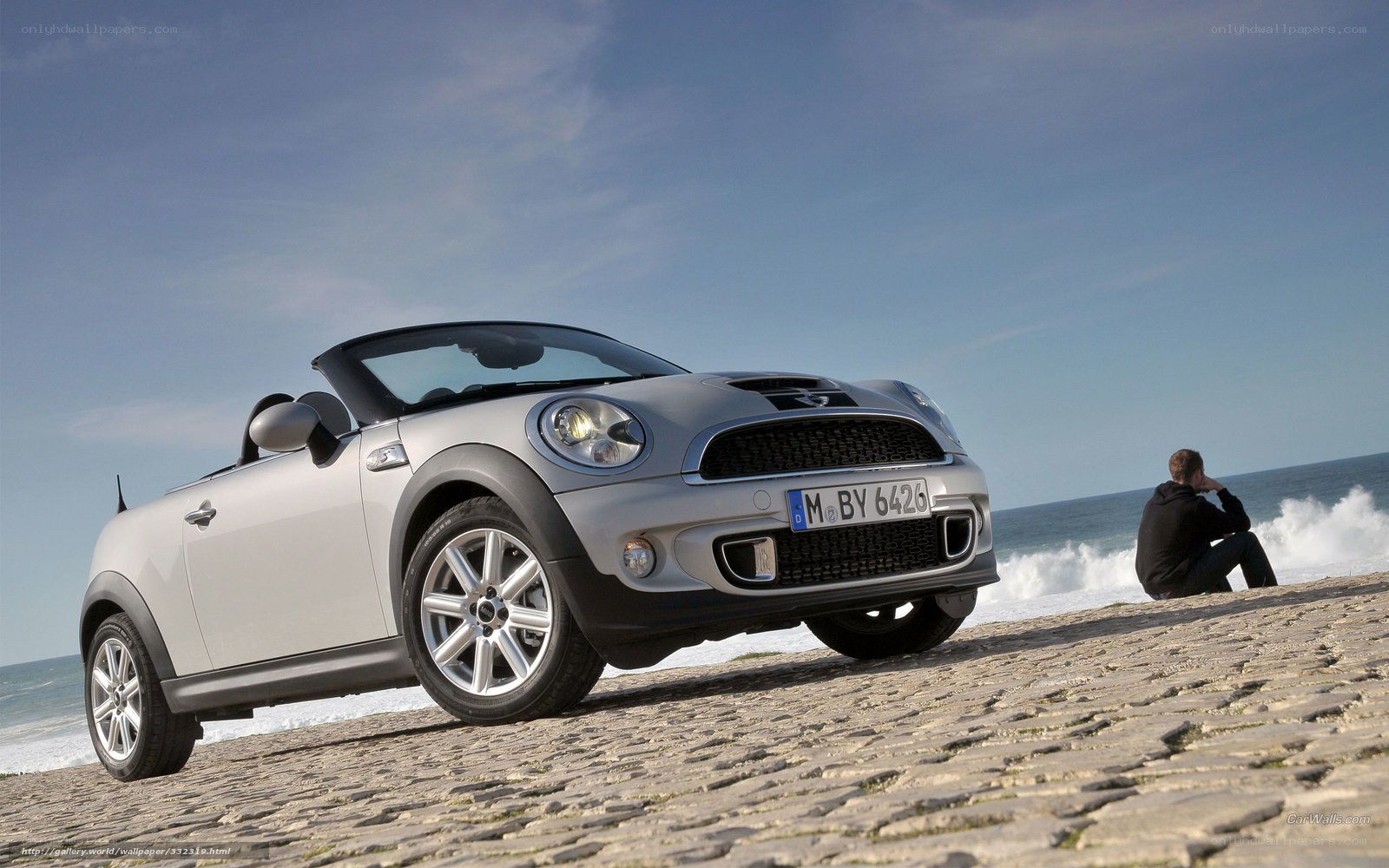 Silver MINI Cooper parked on beach