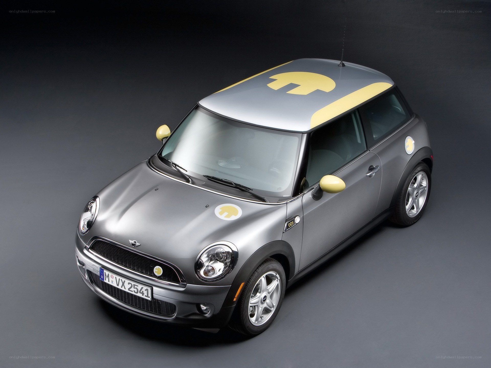 Silver Mini Cooper with yellow accents