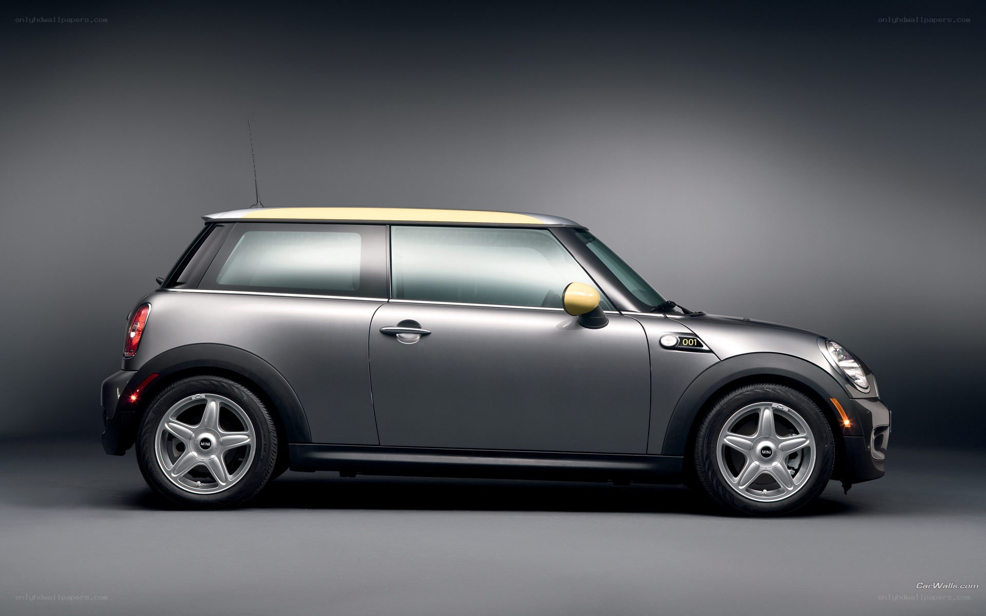silver mini cooper with yellow roof