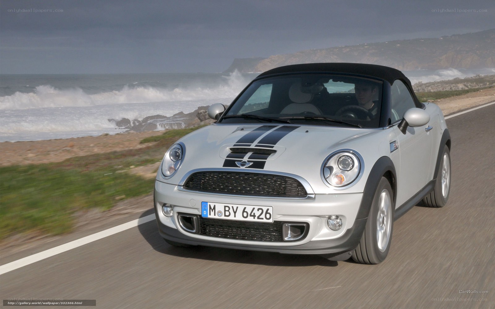 Silver MINI Roadster on coastal road