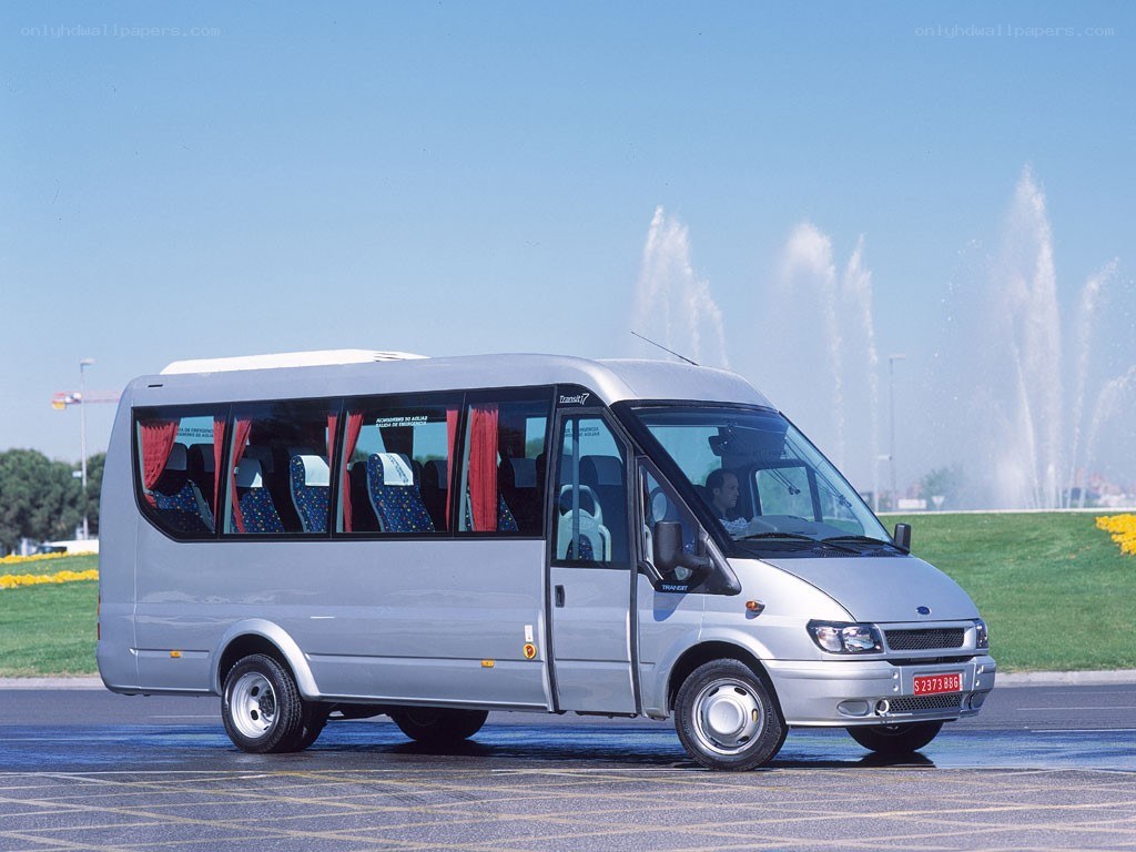 Silver minibus with fountain background