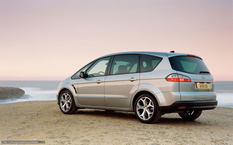 silver minivan on beach