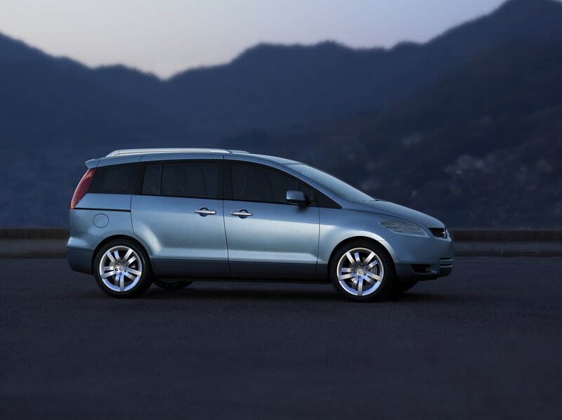 silver minivan on mountain road