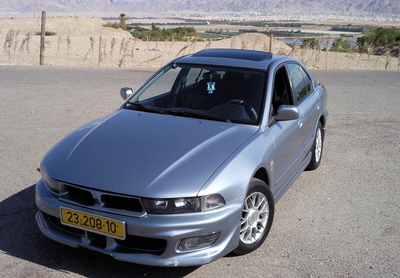 silver mitsubishi car in desert