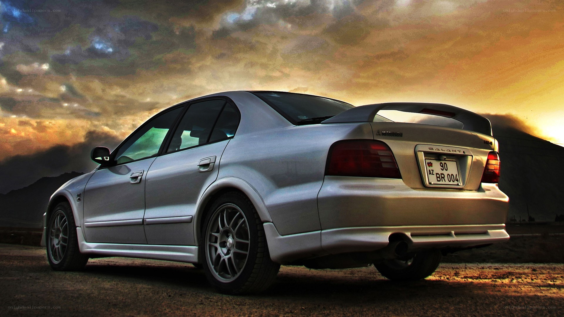 silver mitsubishi galant at sunset