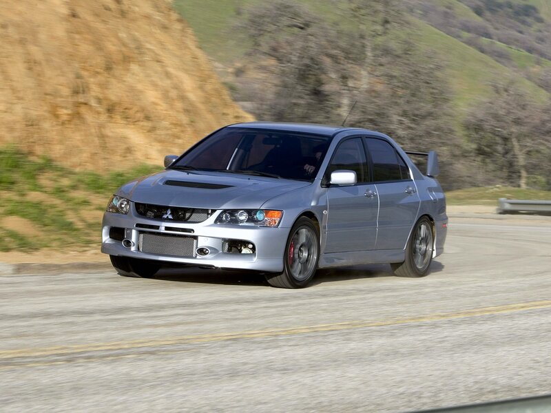 silver mitsubishi lancer evolution on road