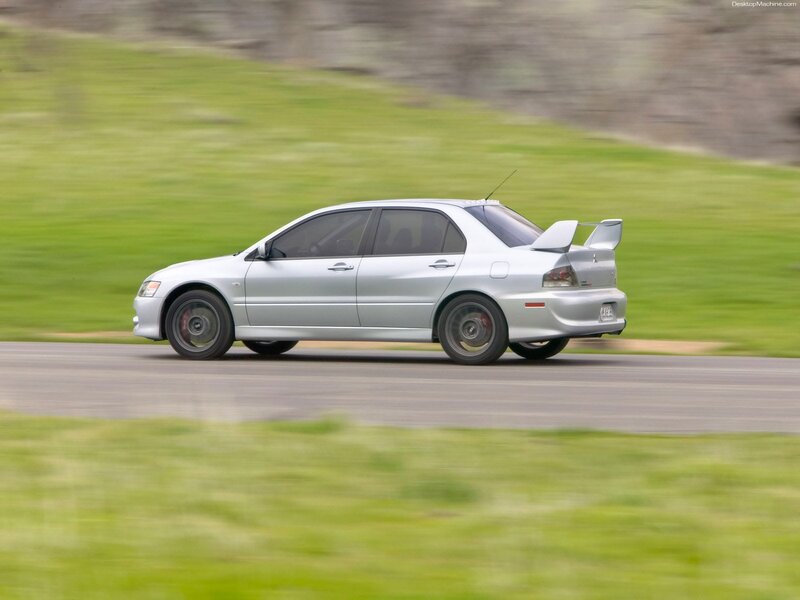silver mitsubishi lancer evolution on track
