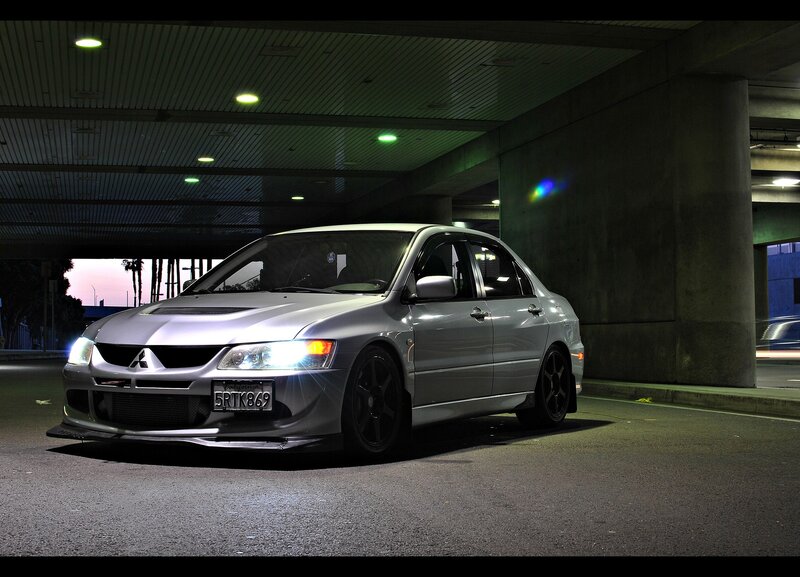 Silver Mitsubishi Lancer in parking garage