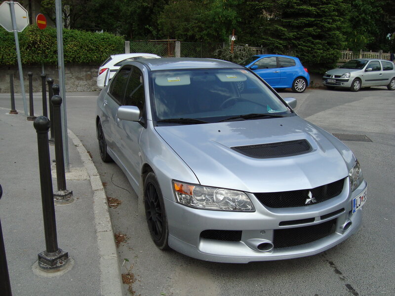 Silver Mitsubishi Lancer parked on street