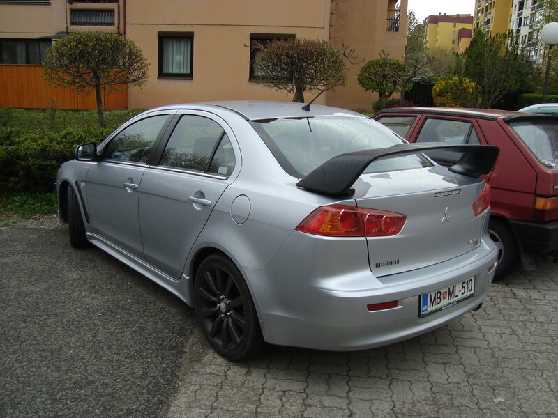 Silver Mitsubishi Lancer parked