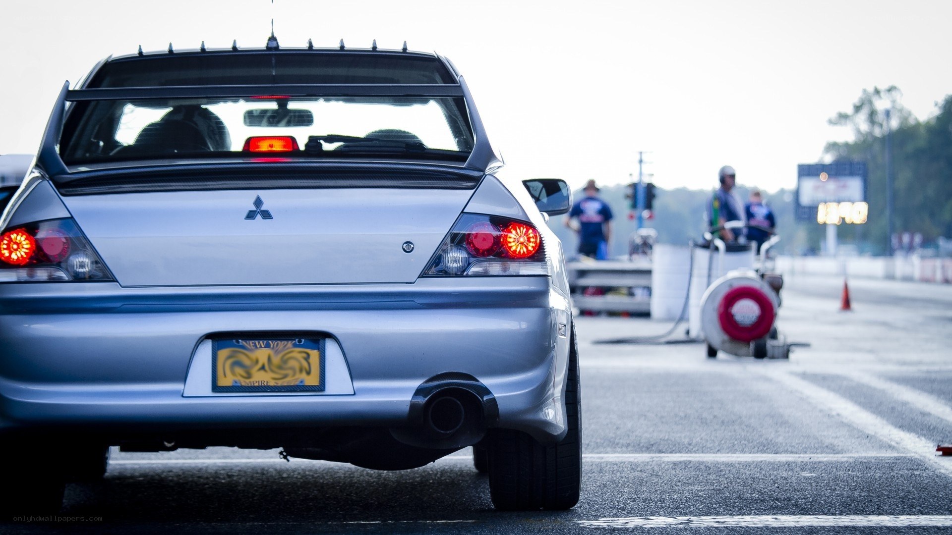 Silver Mitsubishi on a racetrack