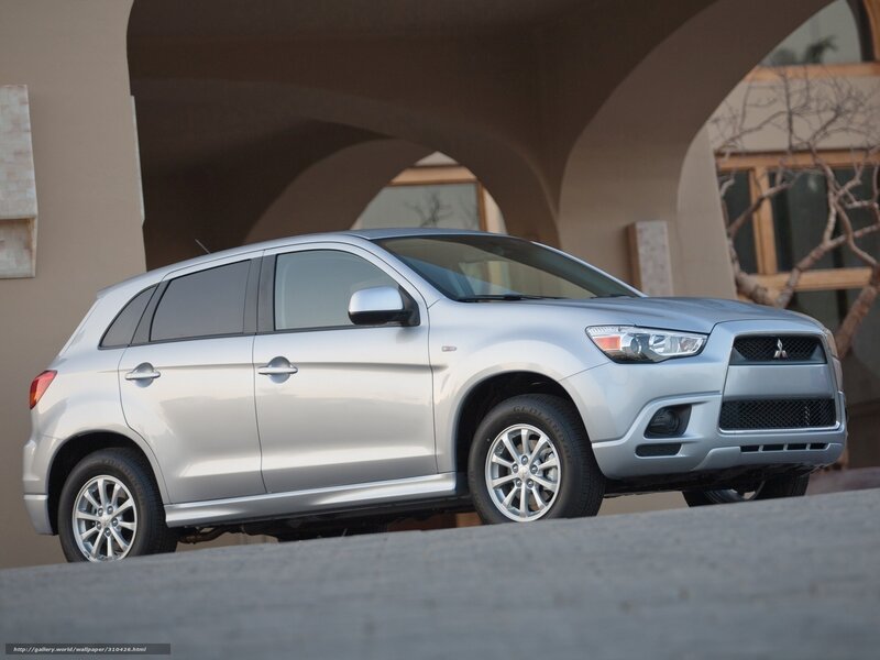 Silver Mitsubishi RVR parked under arches