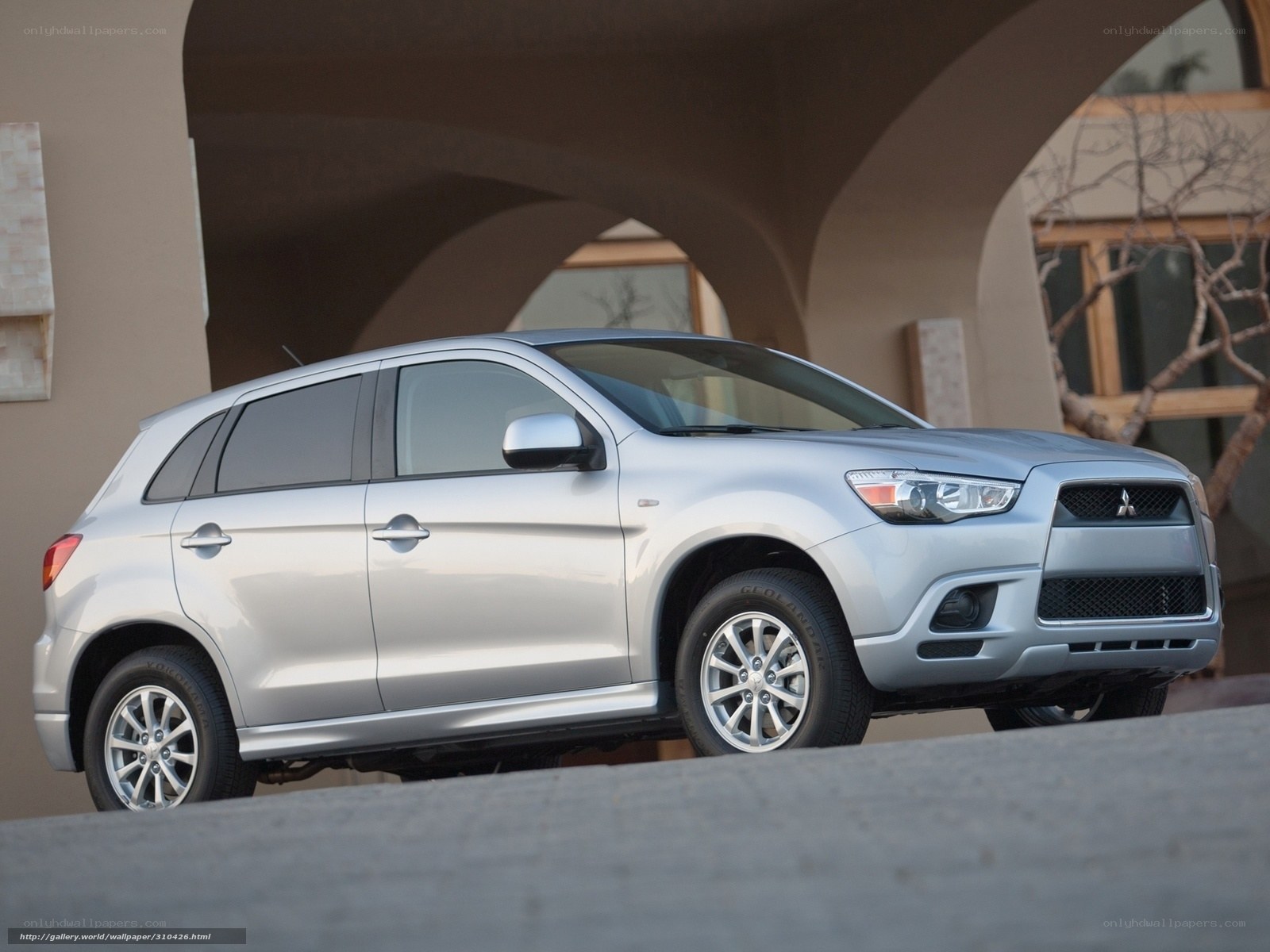 Silver Mitsubishi RVR parked under arches