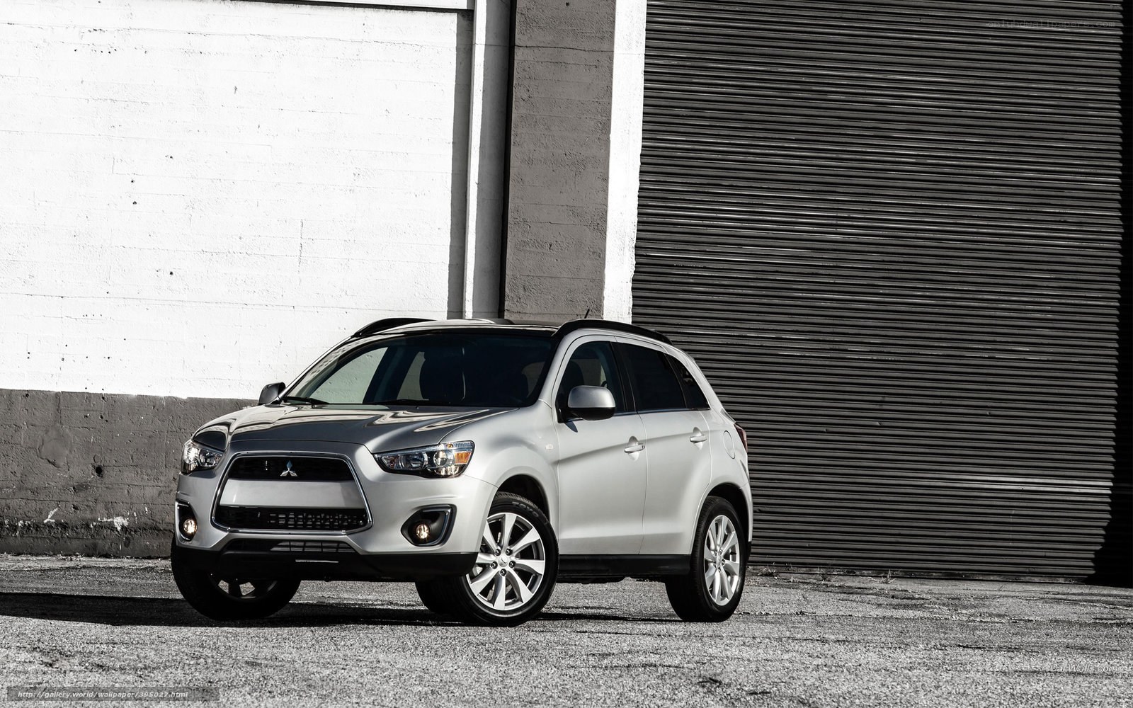 Silver Mitsubishi SUV in urban setting