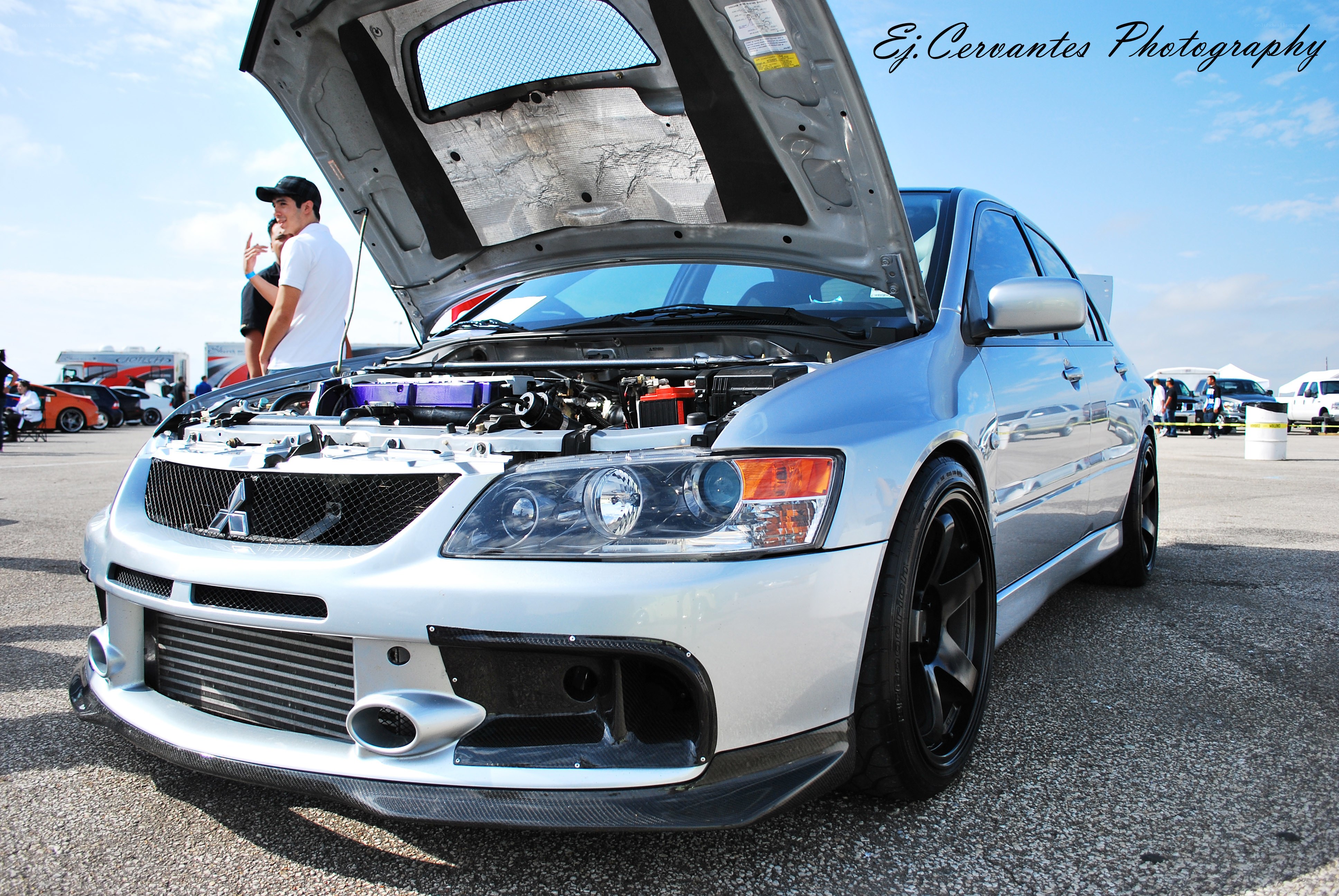 Silver Mitsubishi with open hood