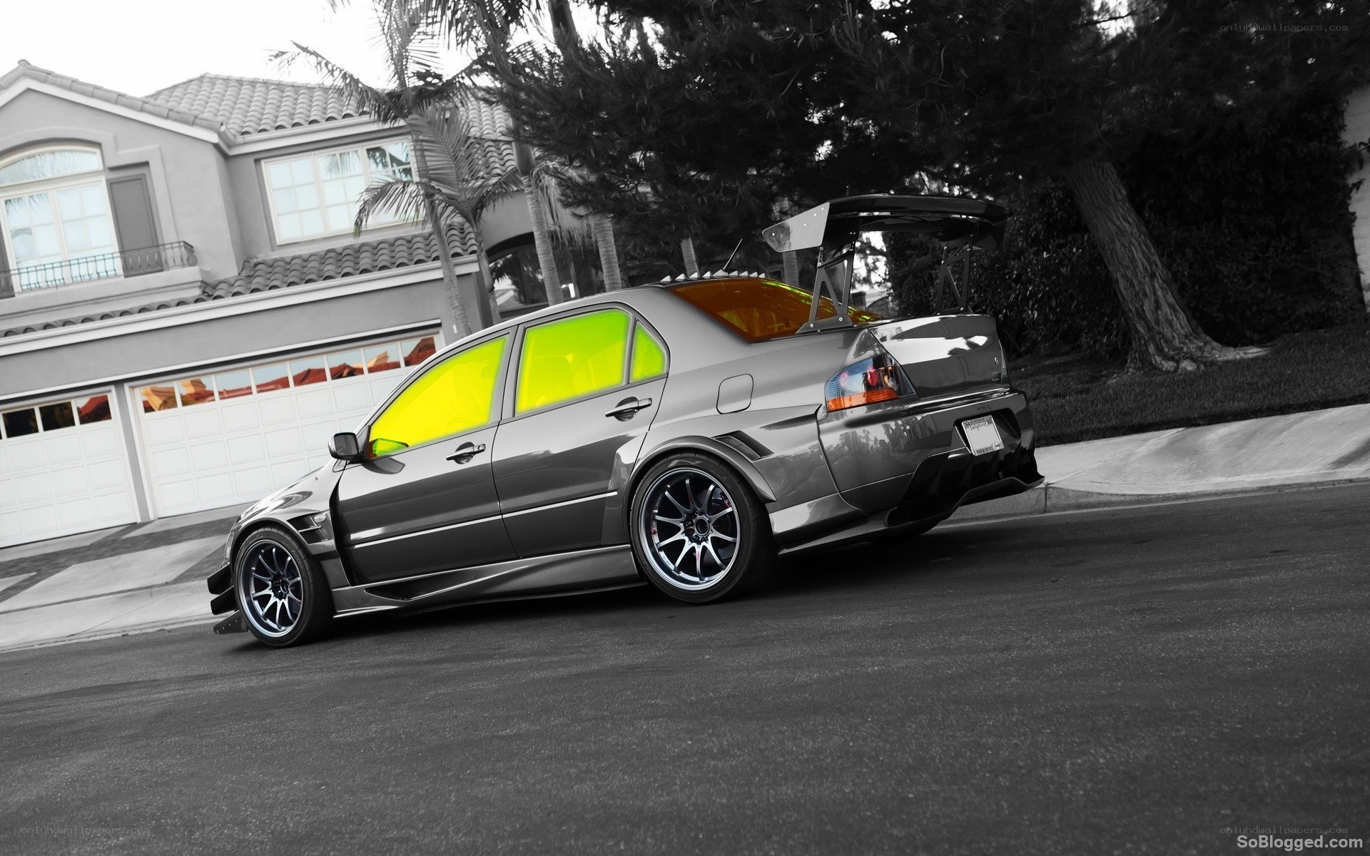 silver modified sedan on street