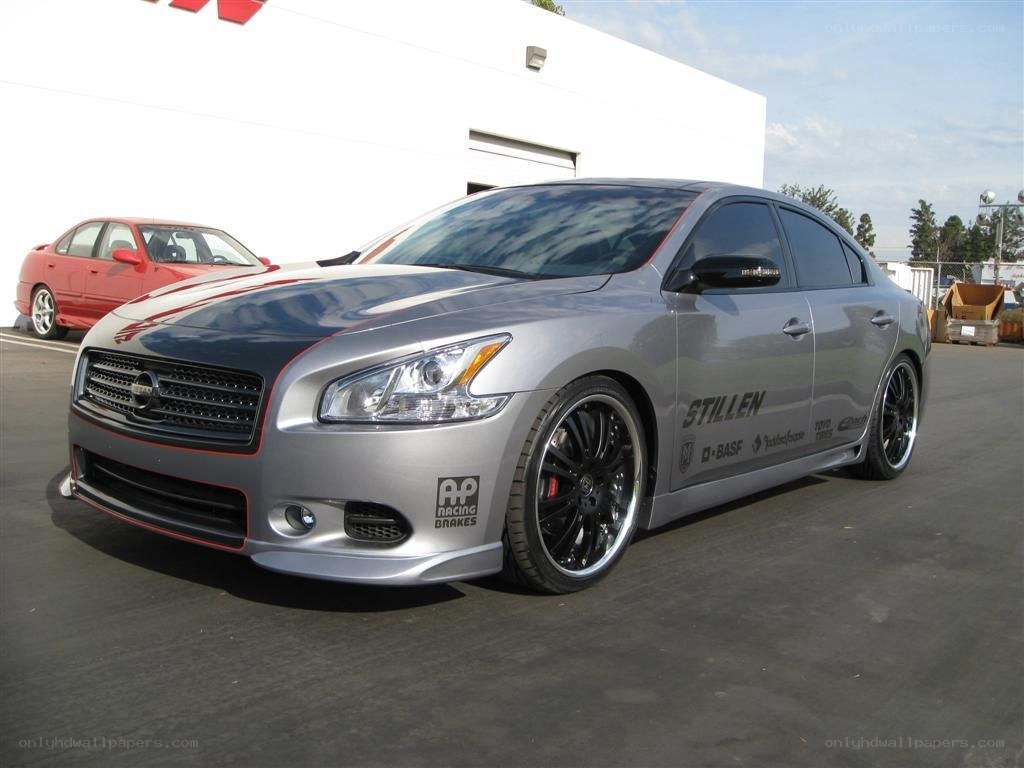 silver modified sedan with decals