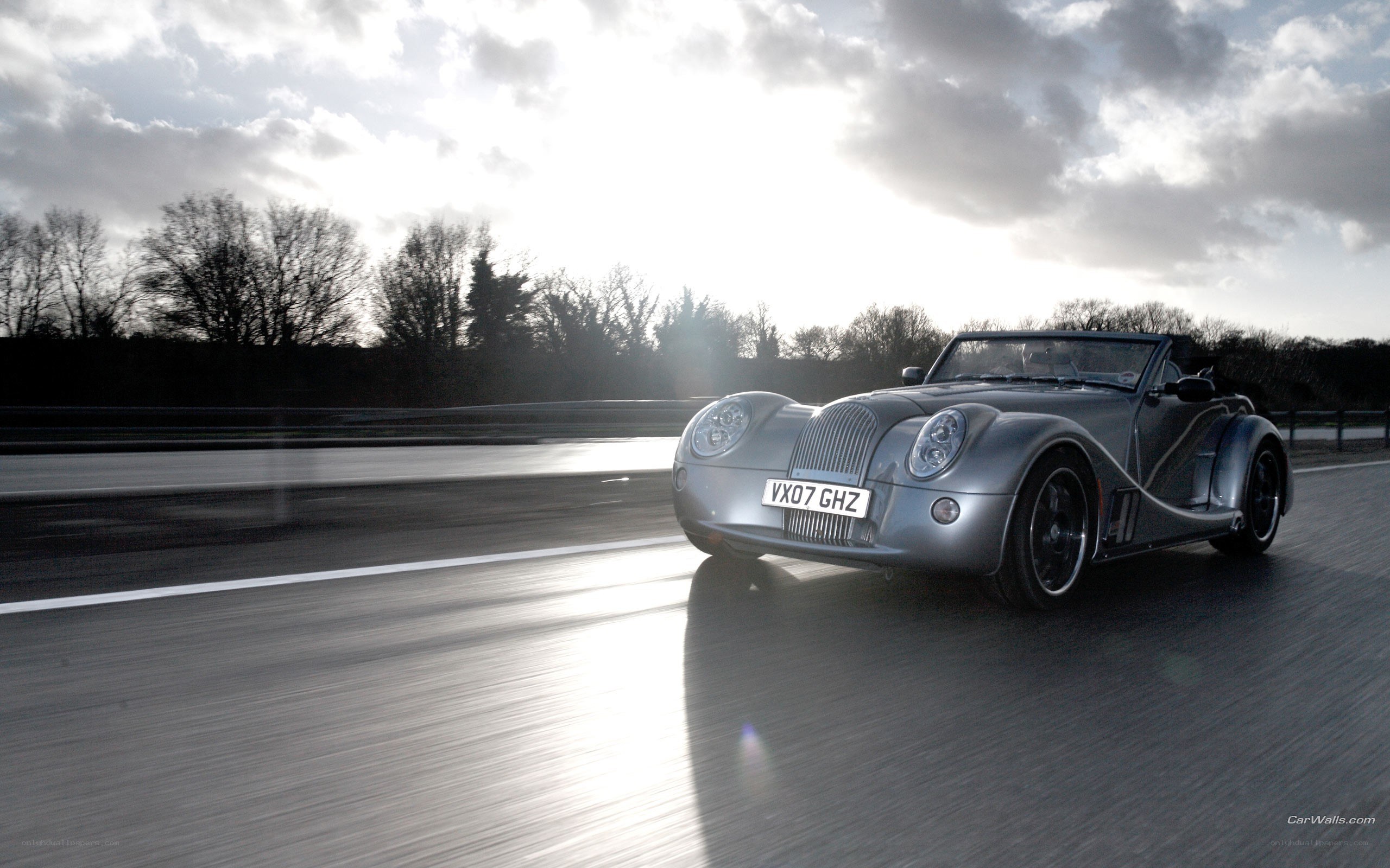 silver Morgan car on road