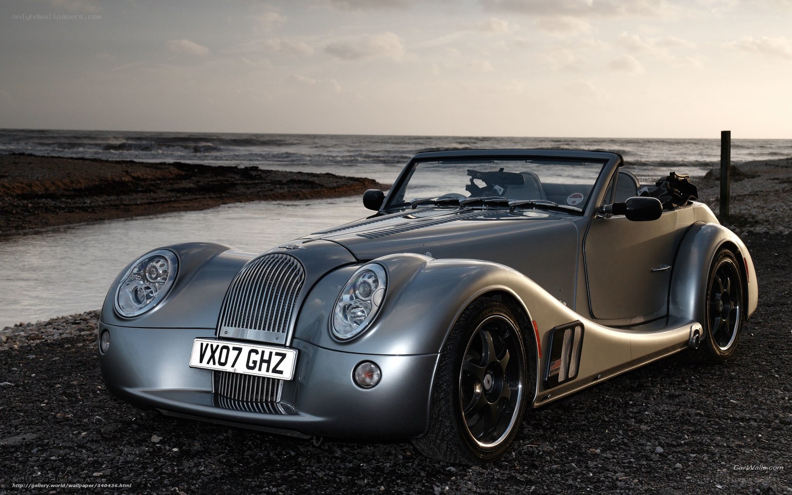 Silver Morgan Roadster on beach