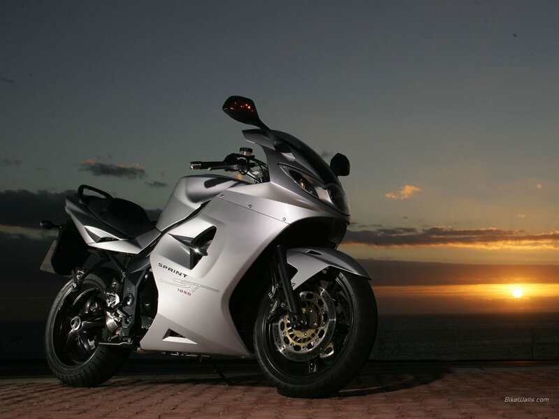 Silver motorcycle at sunset