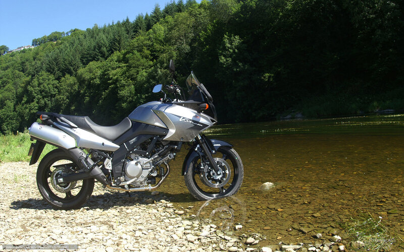 Silver motorcycle by a river