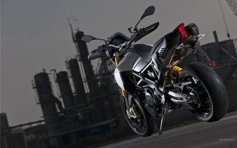 silver motorcycle in industrial setting