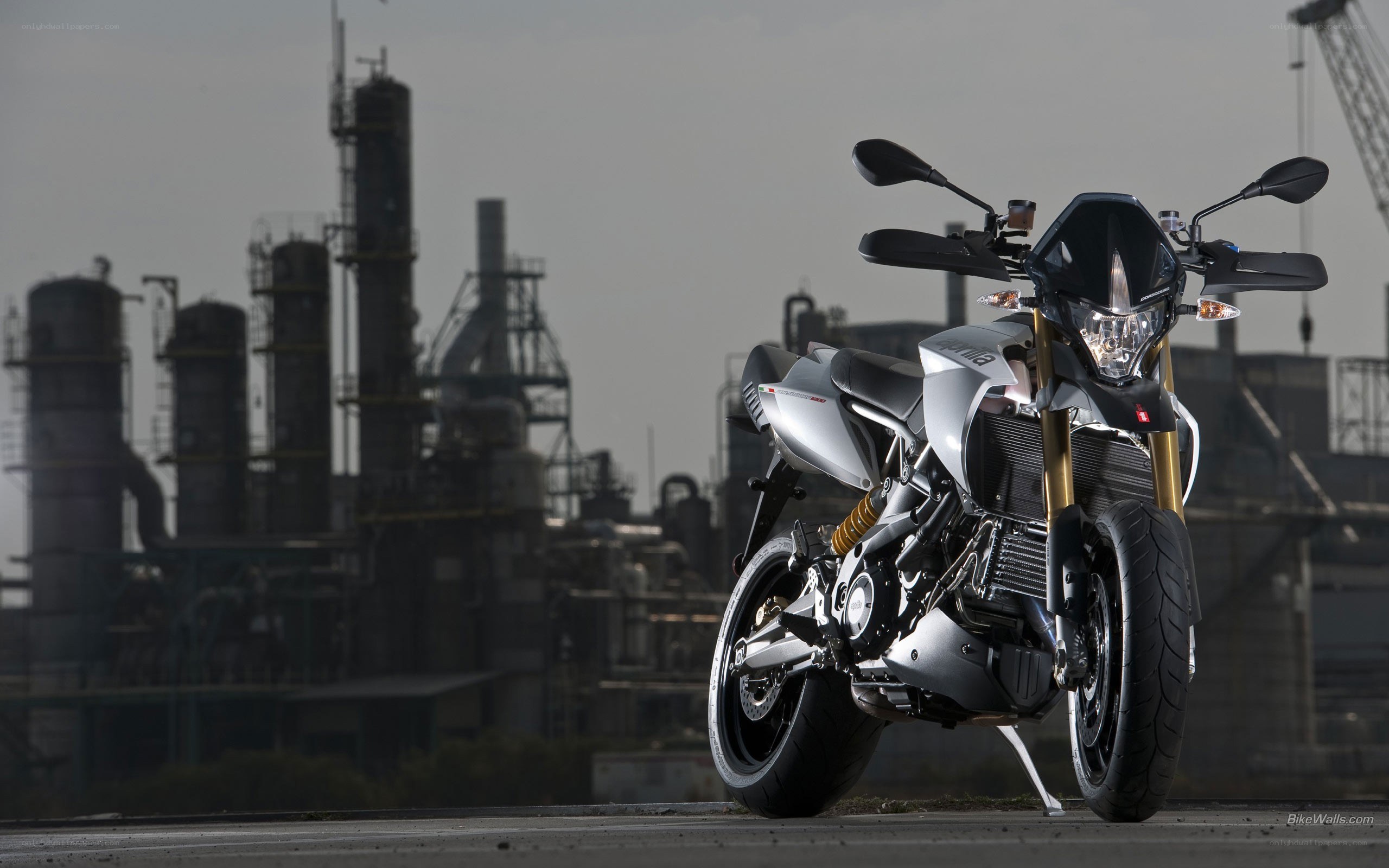 Silver motorcycle in industrial setting