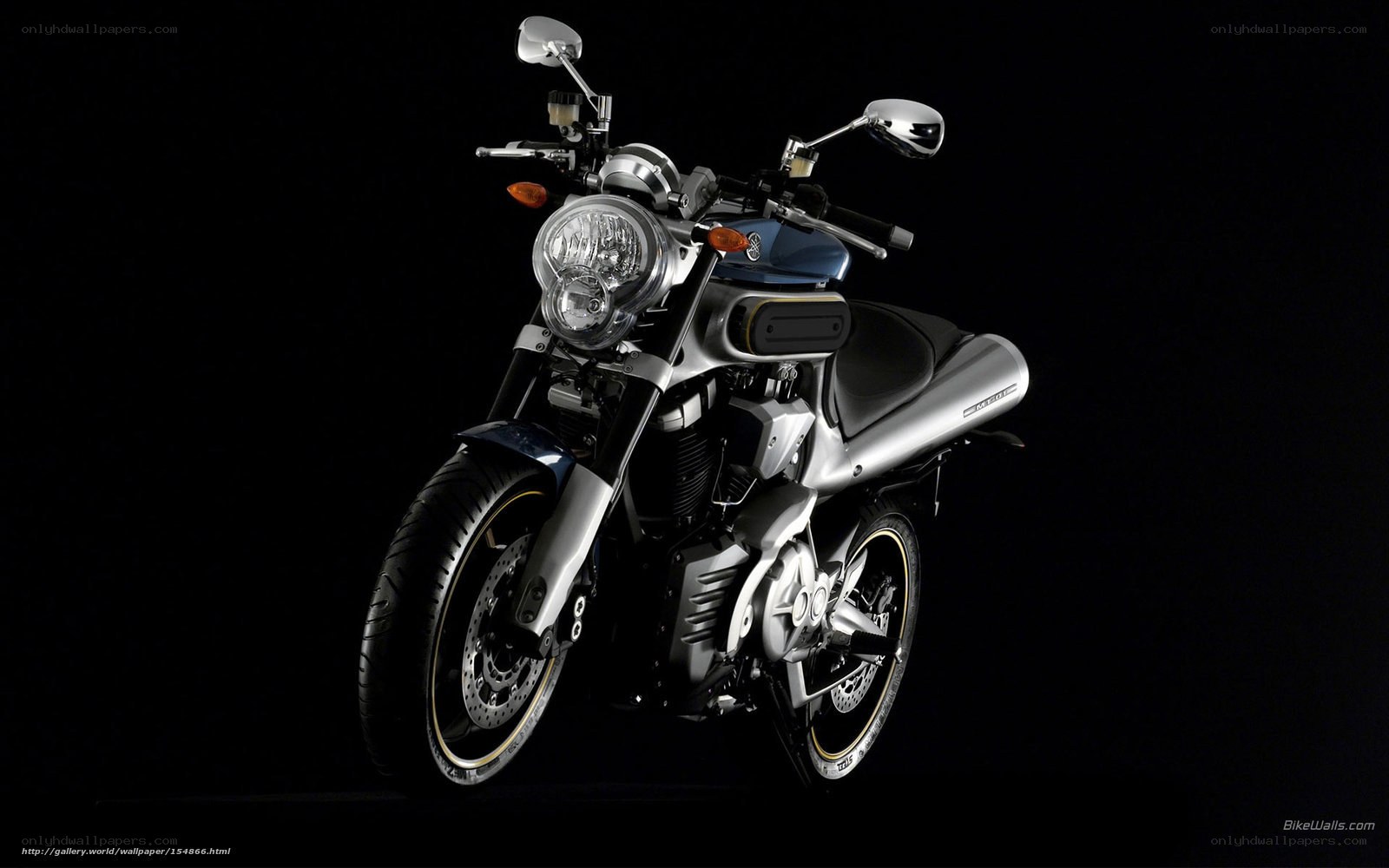 silver motorcycle on black background