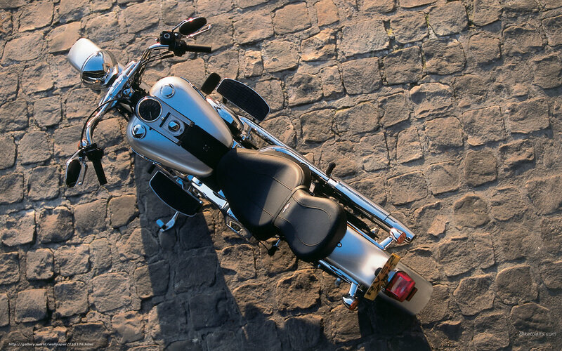 silver motorcycle on cobblestones