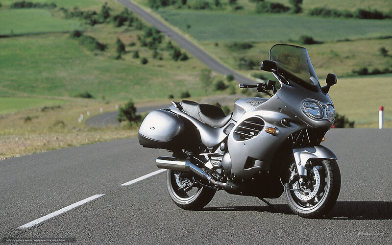 silver motorcycle on country road