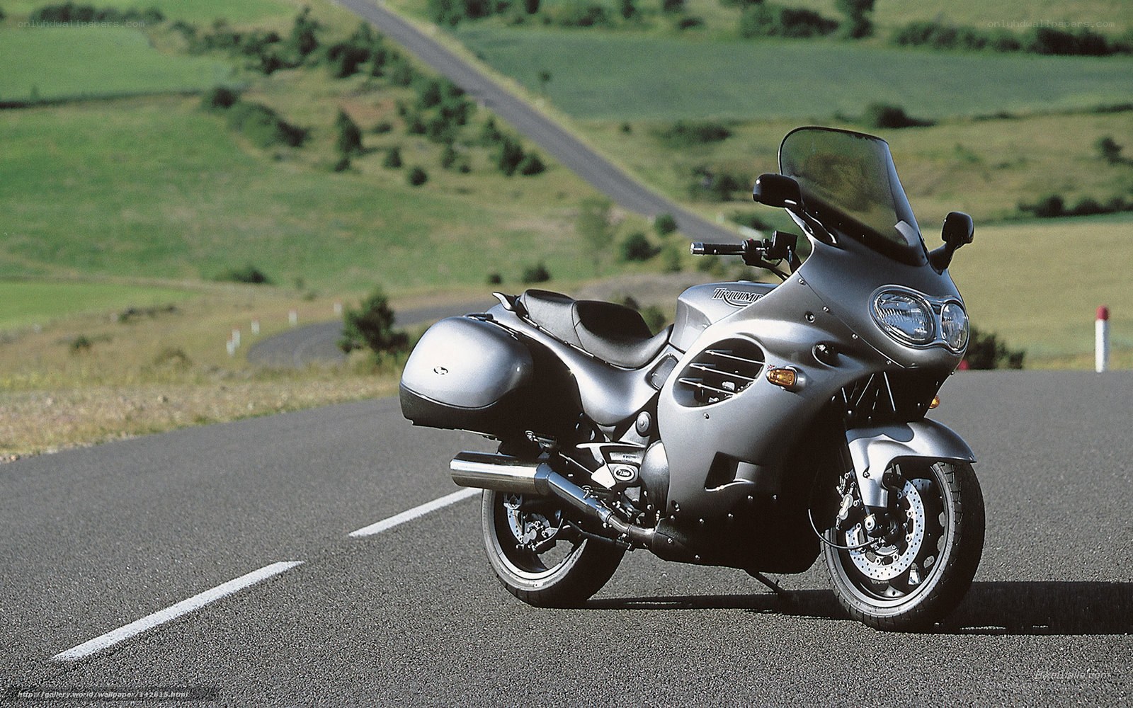 silver motorcycle on country road