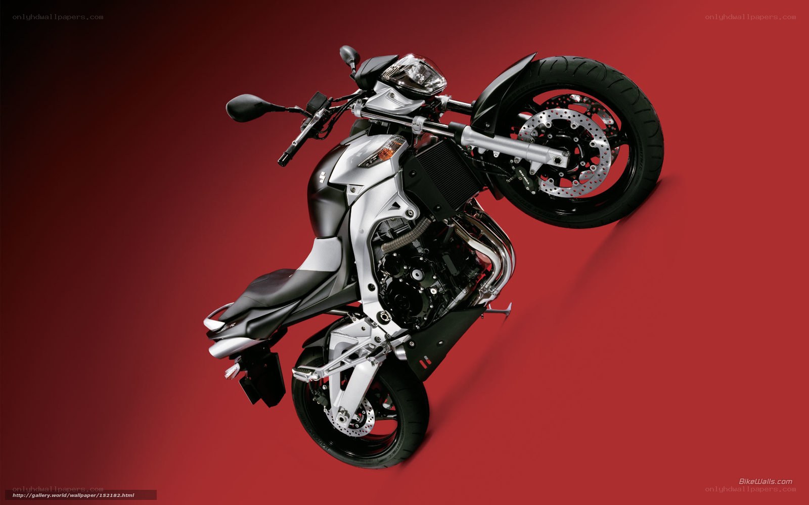silver motorcycle on red background