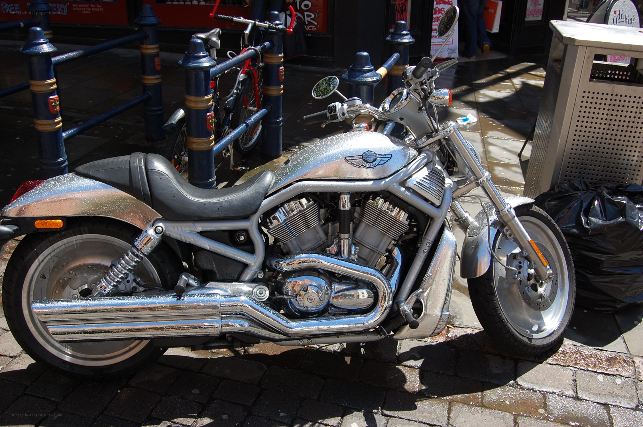 Silver motorcycle parked on street