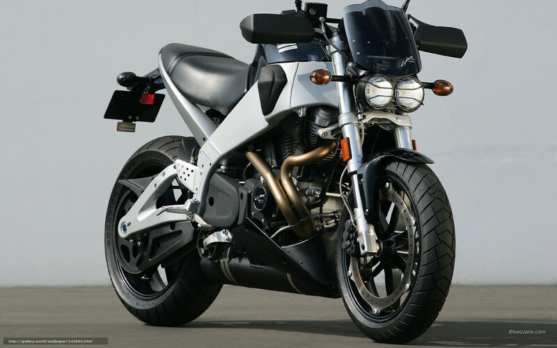 silver motorcycle with dual headlights