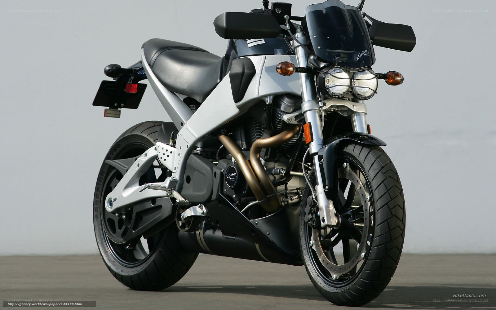 silver motorcycle with dual headlights