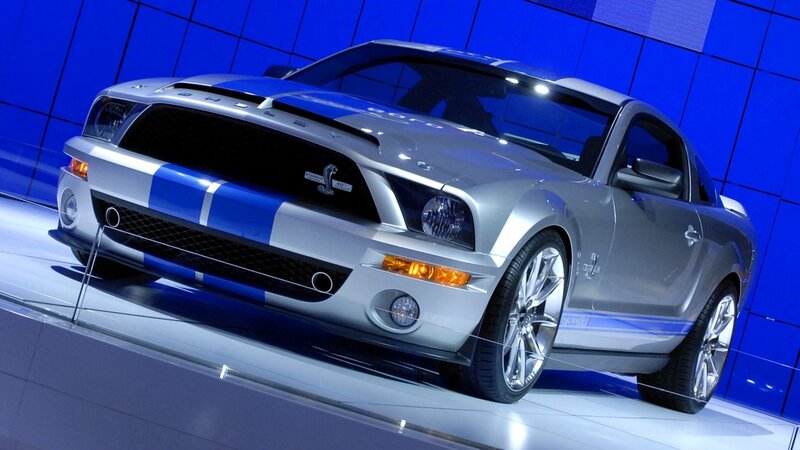 Silver Muscle Car — Dramatic, Photograph, Blue Stripes, Showroom