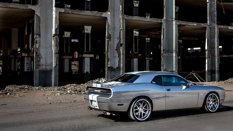 Silver Muscle Car — Gray, Dramatic, Afternoon, Photograph, Abandoned Building, Concrete Pillars, Debris
