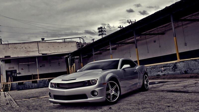 Silver Muscle Car — Gray, Dramatic, Photograph, Building, Overcast Sky