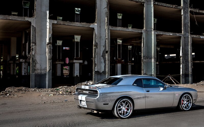 Silver muscle car in abandoned building