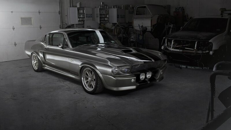 silver muscle car in garage