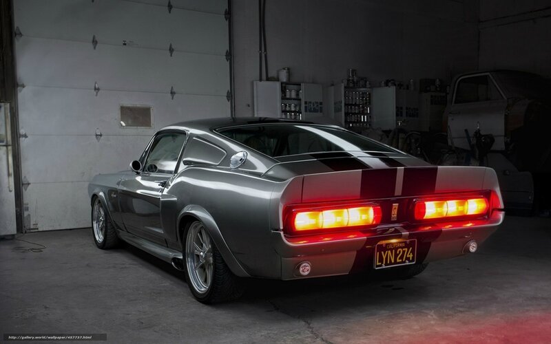 silver muscle car in garage