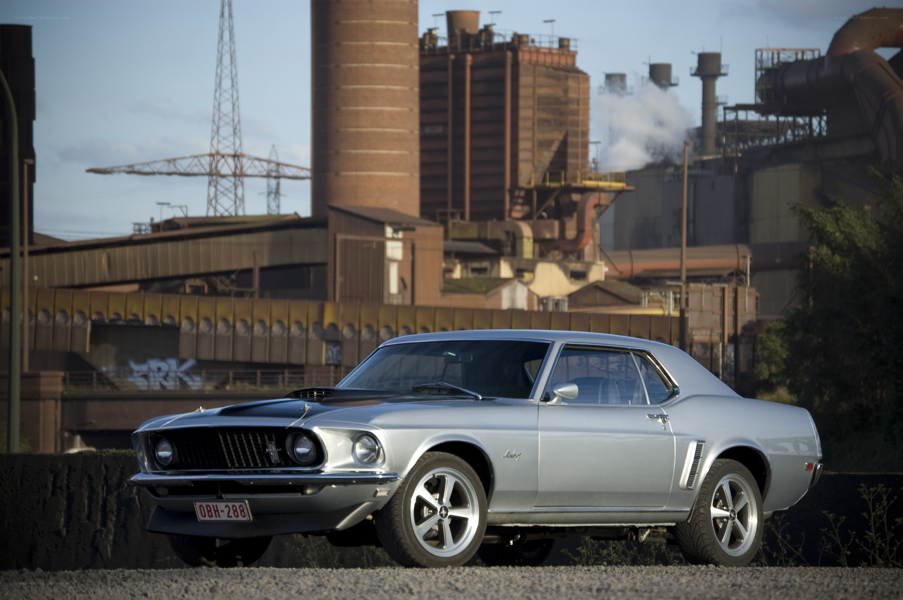 Silver muscle car in industrial setting
