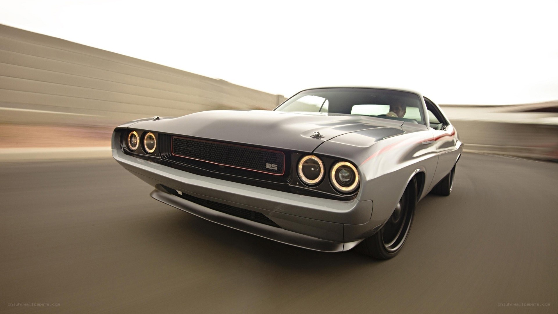 silver muscle car in motion