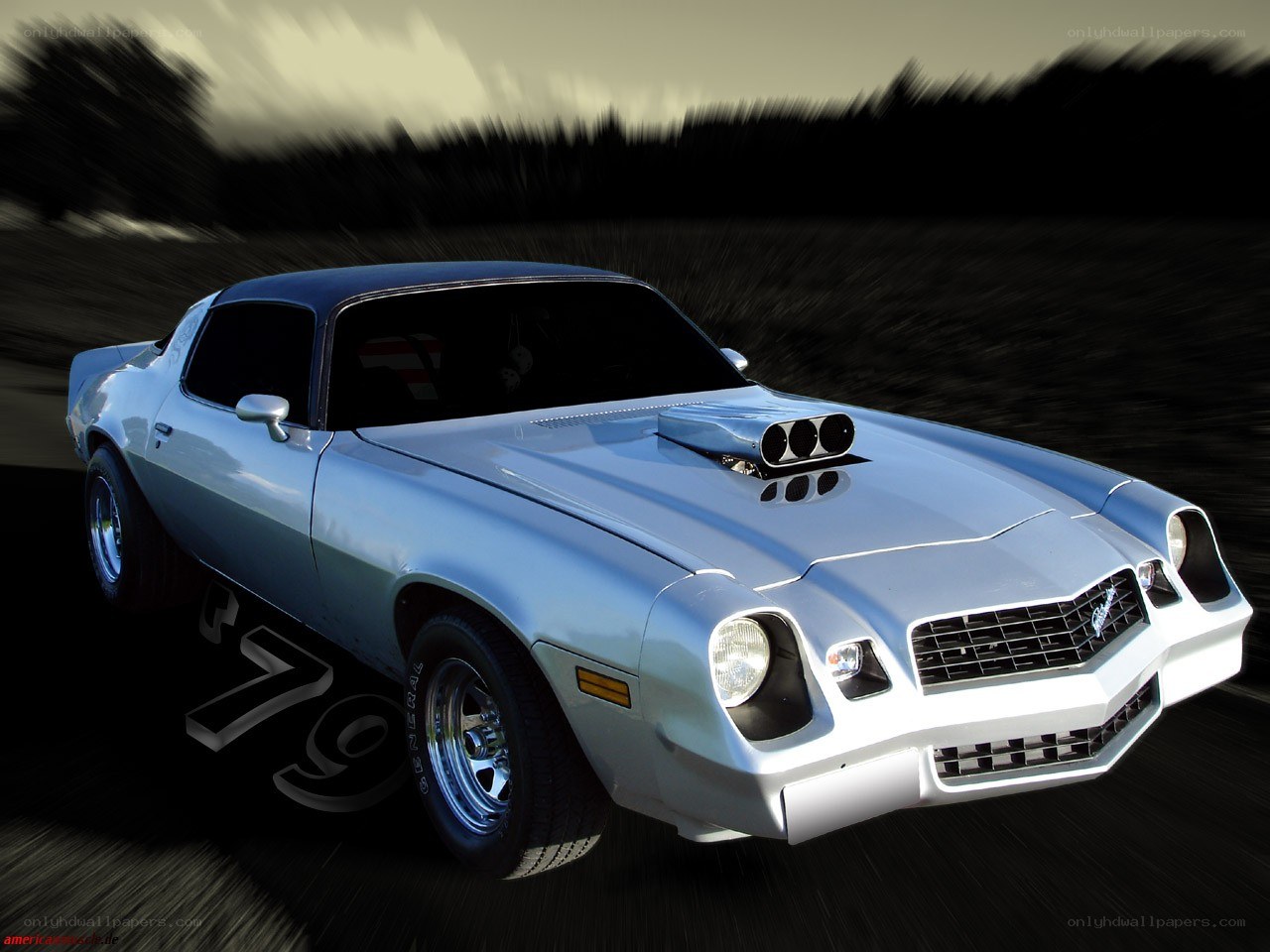silver muscle car in motion