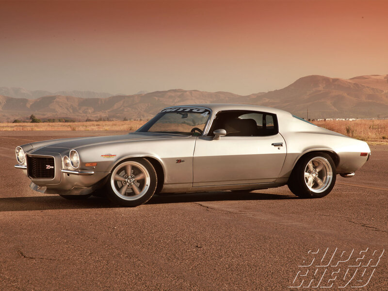 Silver muscle car on desert road