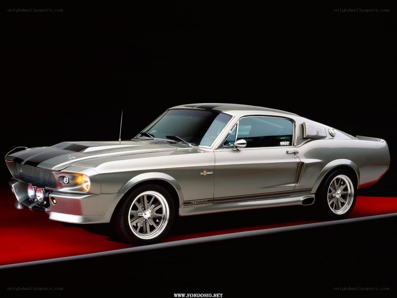 silver muscle car on red carpet