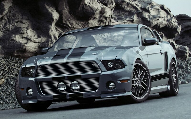 silver muscle car on rocky road