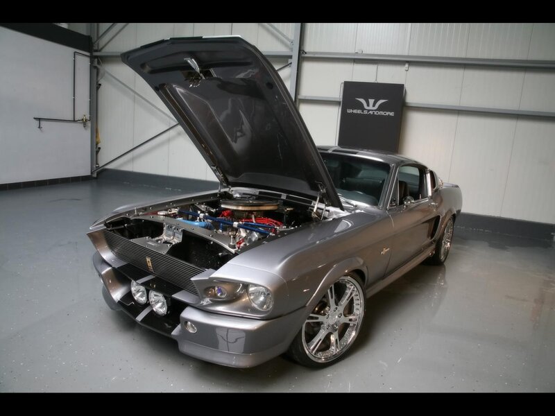 silver muscle car with open hood